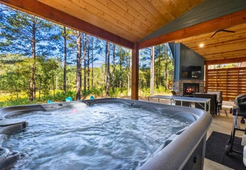 Relax in the warm embrace of the hot tub, with nature as your audience