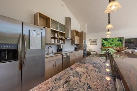 Whip up your favorite creations in this well-appointed kitchen, with all stainless appliances and beautiful counter tops