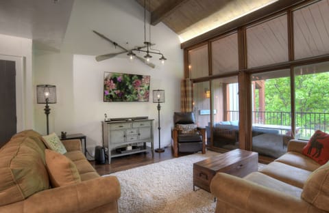 Living Room with Comfortable Furniture, Modern Mountain Decor, and Smart TV