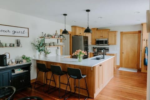 Large kitchen area. Island seats three additional guests.
