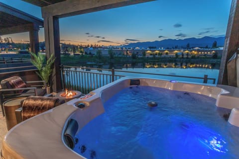 A stunning hot tub on the porch of the unit overlooking Eagle Lake | Exterior