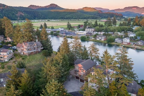 Bird`s eye view of front of home and the Nestucca River.