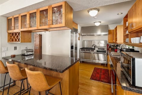 Kitchen with Garland range, double ovens, and griddle