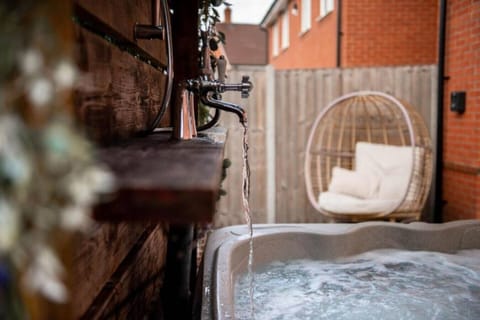 Secluded hot tub area, perfect for unwinding in a private, cozy setting.