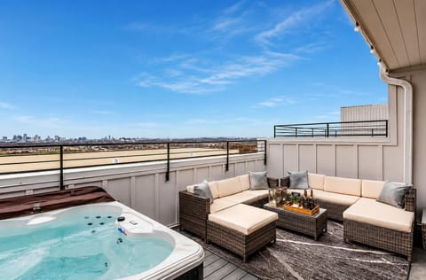 Rooftop lounge designed for relaxing nights with skyline views and hot tub comfort.