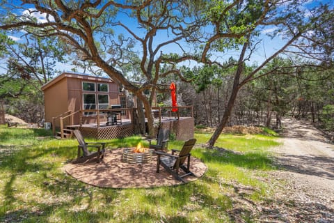 View of the cabin and fire pit area.
