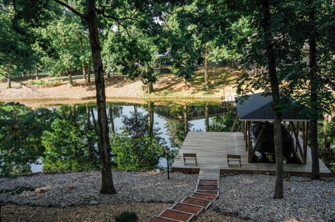 Dock with wooded benches for seating and boat slip on lake DeSoto
