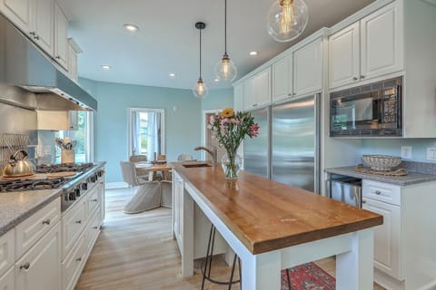 Large kitchen featuring a convenient island, ample counter space, and all the essentials for meal prep.