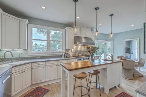 A sleek, fully equipped kitchen with updated appliances and plenty of space to cook and gather.