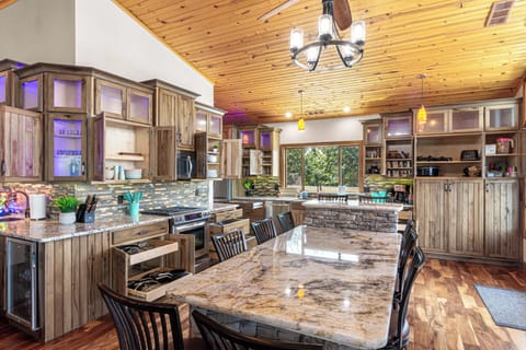 The kitchen comes fully stocked and ready to entertain, with 2 full-sized refrigerators, 2 indoor mini fridges, and 2 more on the dock for easy access to cold drinks by the lake