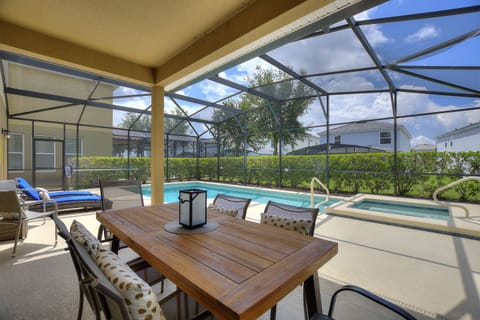 The spacious lanai and pool area is a stunning retreat that seamlessly blends indoor and outdoor living