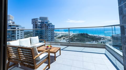 Spacious balcony offers front-row ocean views, perfect for morning coffee or sunset moments by the sea.