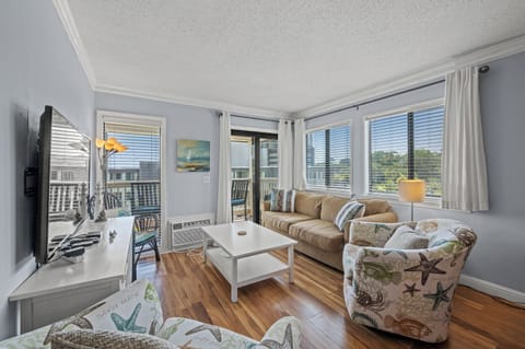 This comfy living room offers space for everyone to gather!