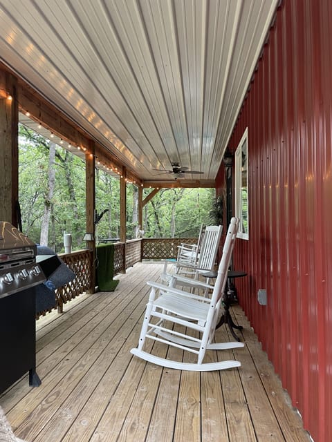 Nice front porch with 4 rocking chairs to sit and relax