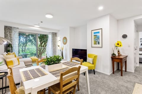 Open-plan living, dining and kitchen areas.
