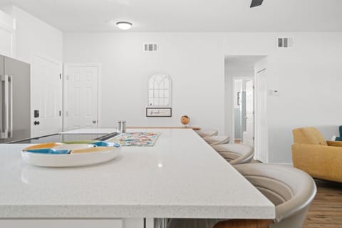 Gather around the kitchen island— 4 seats perfect for breakfast, snacks, or casual conversations.