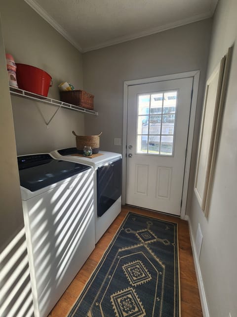 Laundry room with all the supplies needed to tidy & scrub!