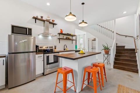 Fully stocked & well-lit kitchen for all your cooking needs.