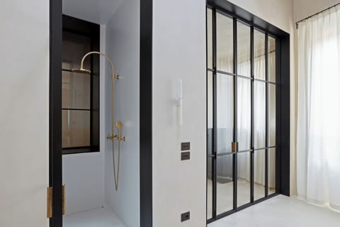 Junior Suite, 1 King Bed | Bathroom | Shower, free toiletries, hair dryer, bathrobes