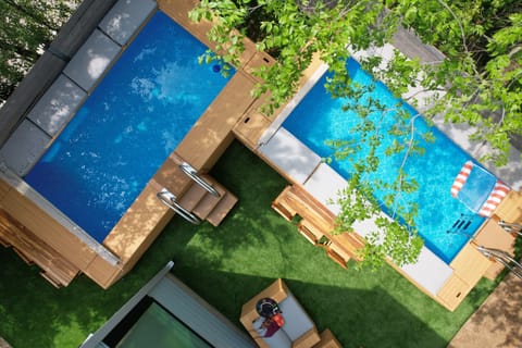 Two pools with turfed area, bar setup and more!