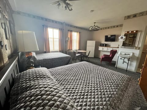 Family Room, 2 Queen Beds, Non Smoking | In-room safe, blackout drapes, bed sheets