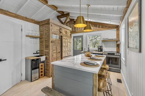 Newly renovated kitchen with wet bar and island.