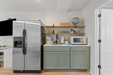 Kitchenette with refrigerator, microwave, keurig, sink