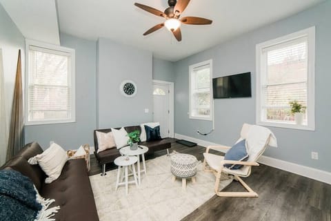 Living room, two couches and Queen Murphy bed, with a ROKU TV