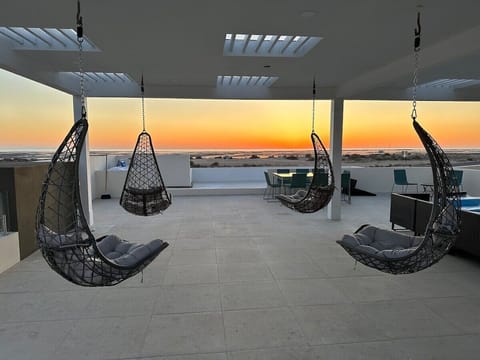 Enjoy magical sunsets over the lagoon and beach from the rooftop deck