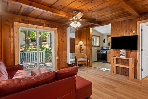 Living Room: Rustic charm with rich wood tones and scenic views for relaxation and fun!
