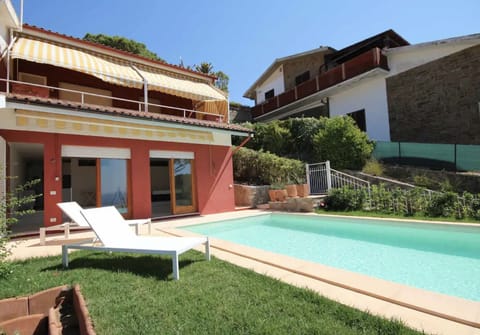 Sun bed and small garden around the pool