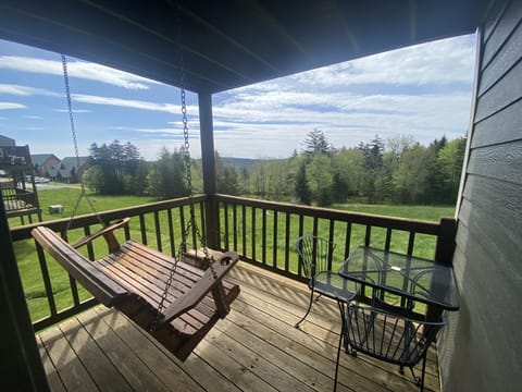 Enjoy the sunrise over the mountains on the swing!