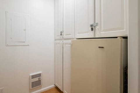 Storage room with extra fridge off kitchen