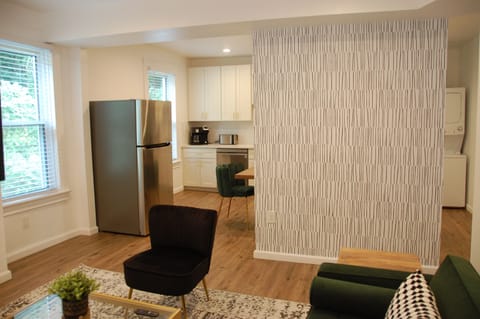 Living room looking to kitchen/dining area