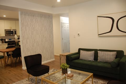 Living room with 65" HDTV - stylish layout with plenty of natural light