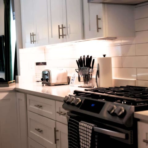 A fully functional kitchen—equipped with top-tier appliances, ample counter space, and everything you need for a seamless cooking experience. It’s where style meets efficiency, making your Cleveland stay feel like home.