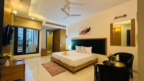 King size Bed with premium mattress & television
