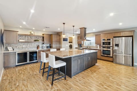 Fully equipped kitchen with large island + stainless appliances