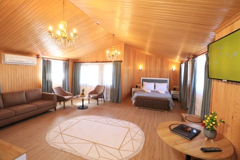 Honeymoon Room | Living area | 32-inch LCD TV with satellite channels