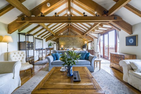 The Old Piggeries, Burton Bradstock: Spacious open-plan sitting and dining area, original beams running throughout