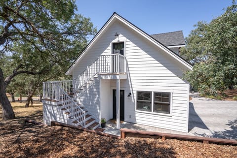 A raised landing and exterior stairs create a tucked-away arrival.