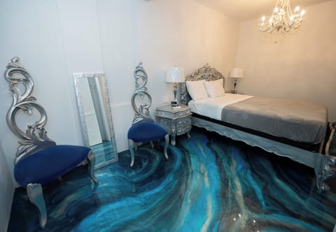 Deluxe Room, 1 Queen Bed | Down comforters, memory foam beds, in-room safe, individually decorated