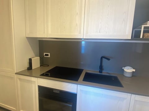 Countertop, Kitchen, Cabinetry, Interior Design, Kitchen Appliance, Flooring, Tap, Furniture, Sink, Major Appliance