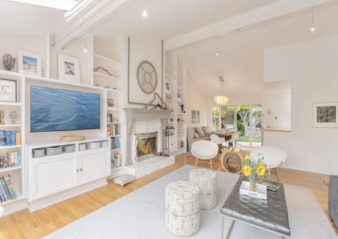 Living Room with Wood Fireplace and Smart TV