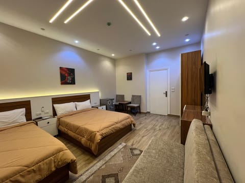 Family Triple Room | Minibar, free WiFi, bed sheets