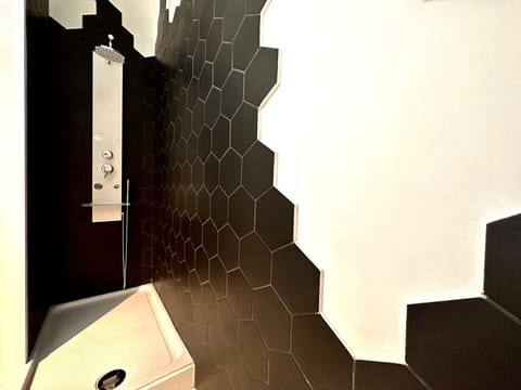 City House | Bathroom | Shower, hair dryer, towels