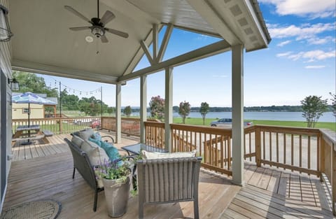Beautiful oversized porch with 2 picnic tables and plenty of covered seating 