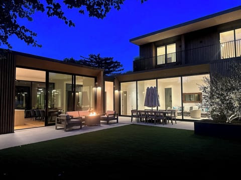 This is our beautiful backyard at night...Enjoy cozying up around the fire pit!!