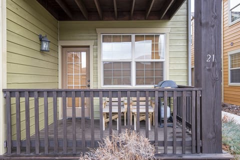 Just off the living area is a small porch, complete with a couple lounge chairs and a propane BBQ.