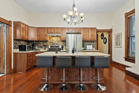 Four bar seats for dining seating at the kitchen island.